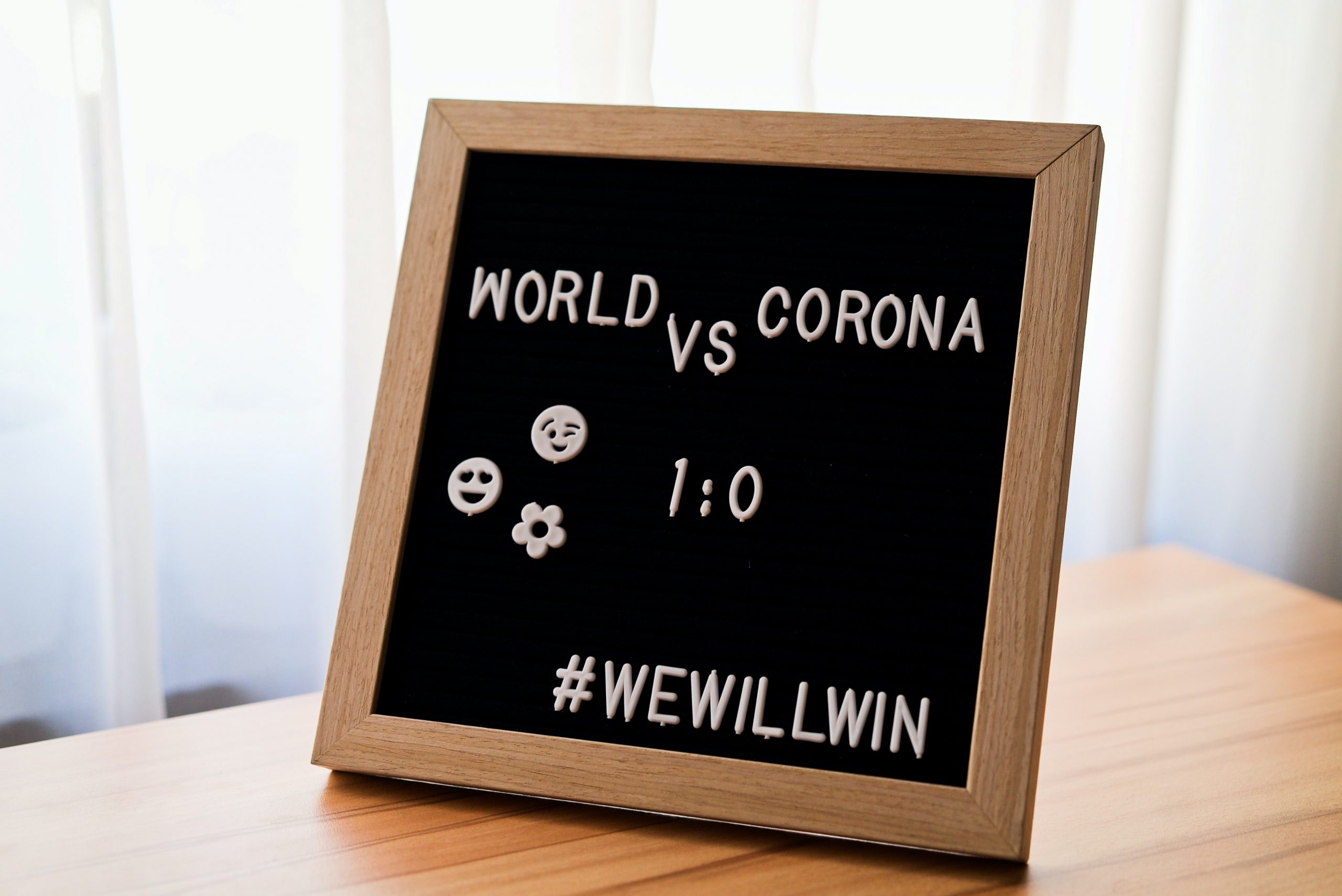 world vs corona sign wewillwin